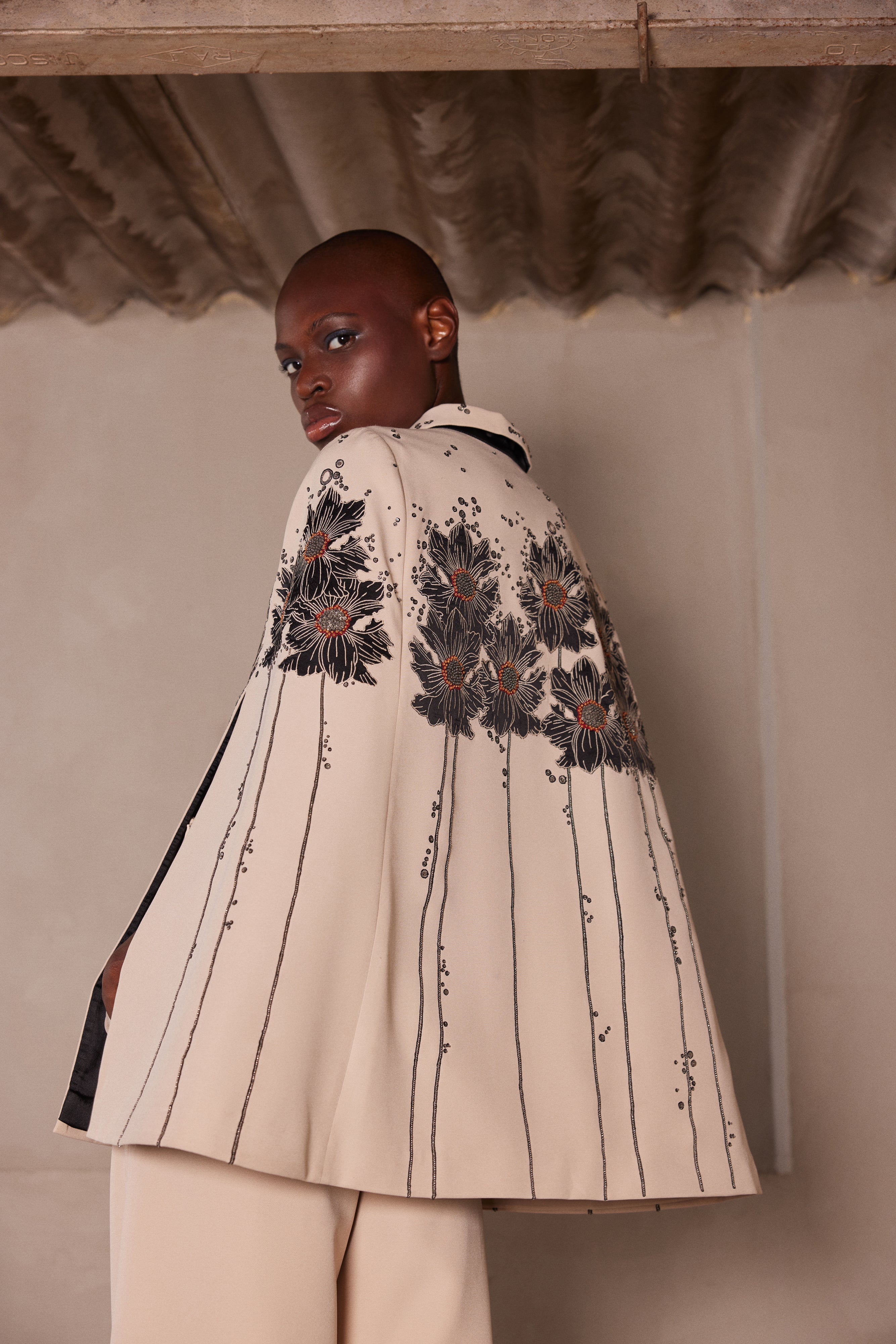 FLORAL PATCH CAPE WITH FLARED PANTS