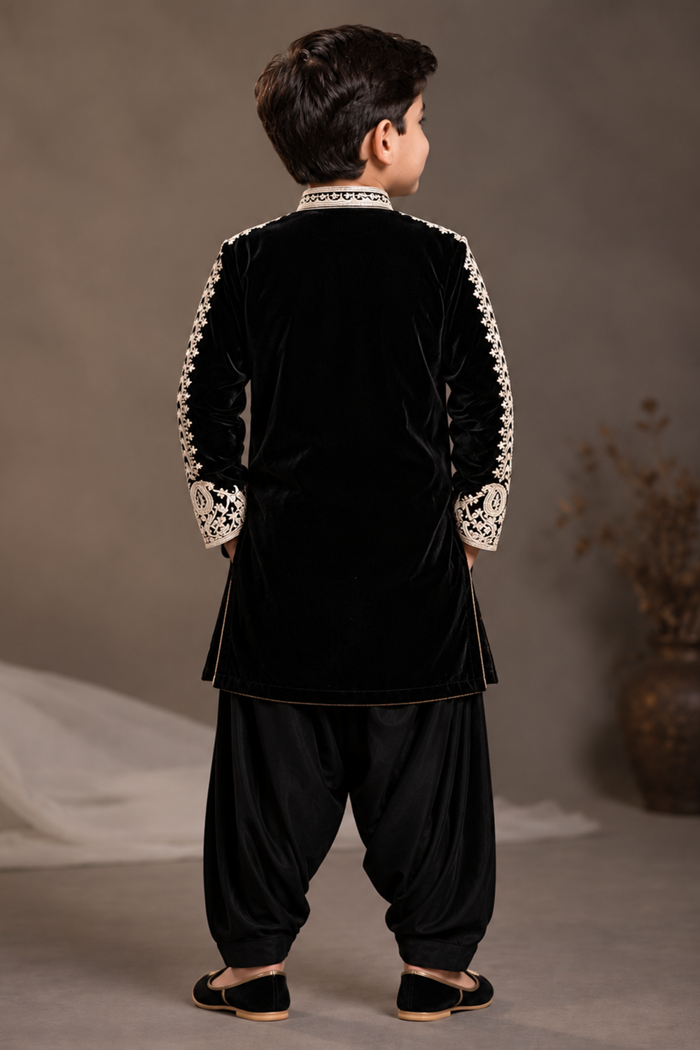 Black  Velvet Kurta  Set Featuring Inticate Golden Embroidery Paired With Classic Salwar