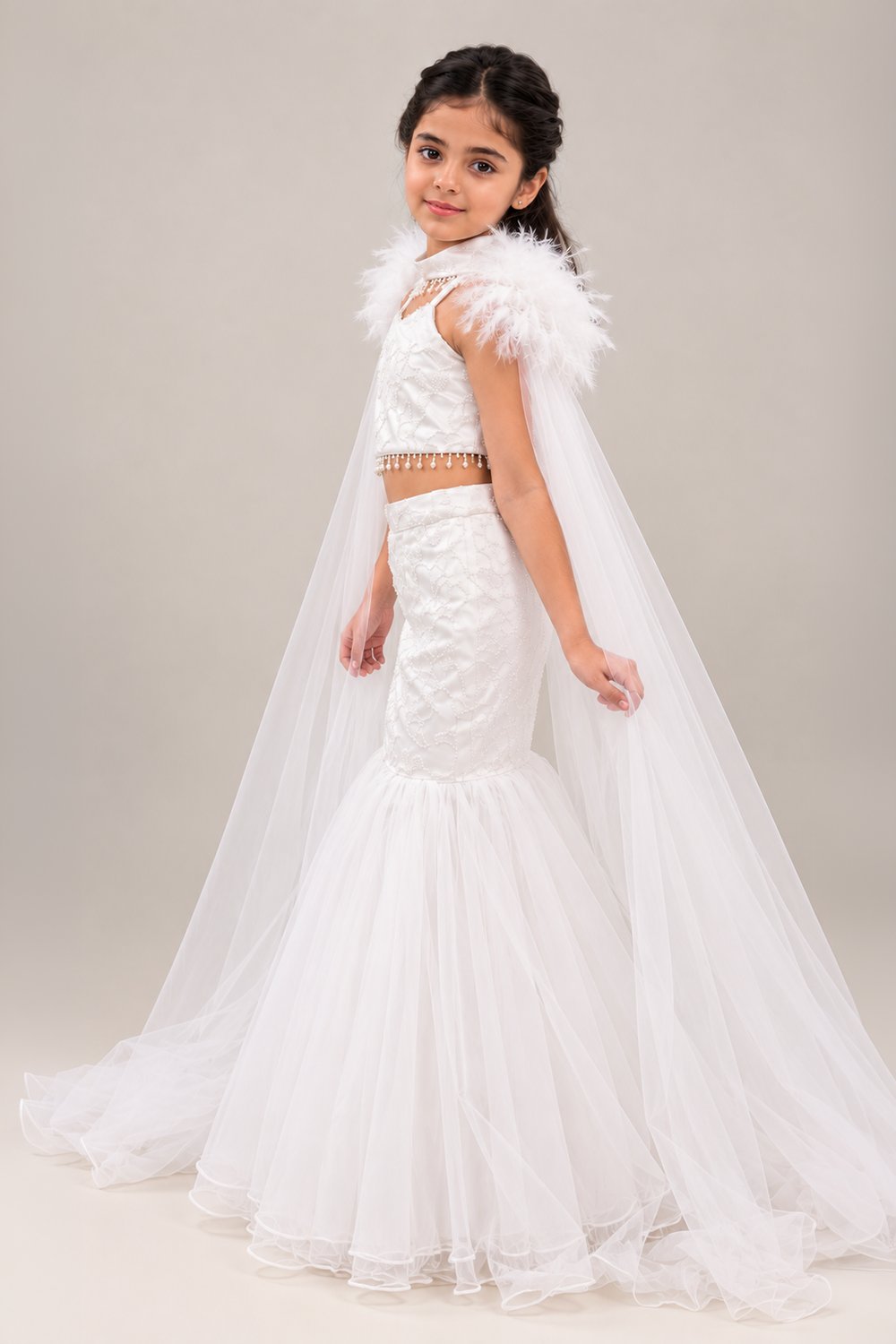 Elegant Fish Cut Lehenga Set Featuring Delicate Embroidery And Dramatic Fur Cape