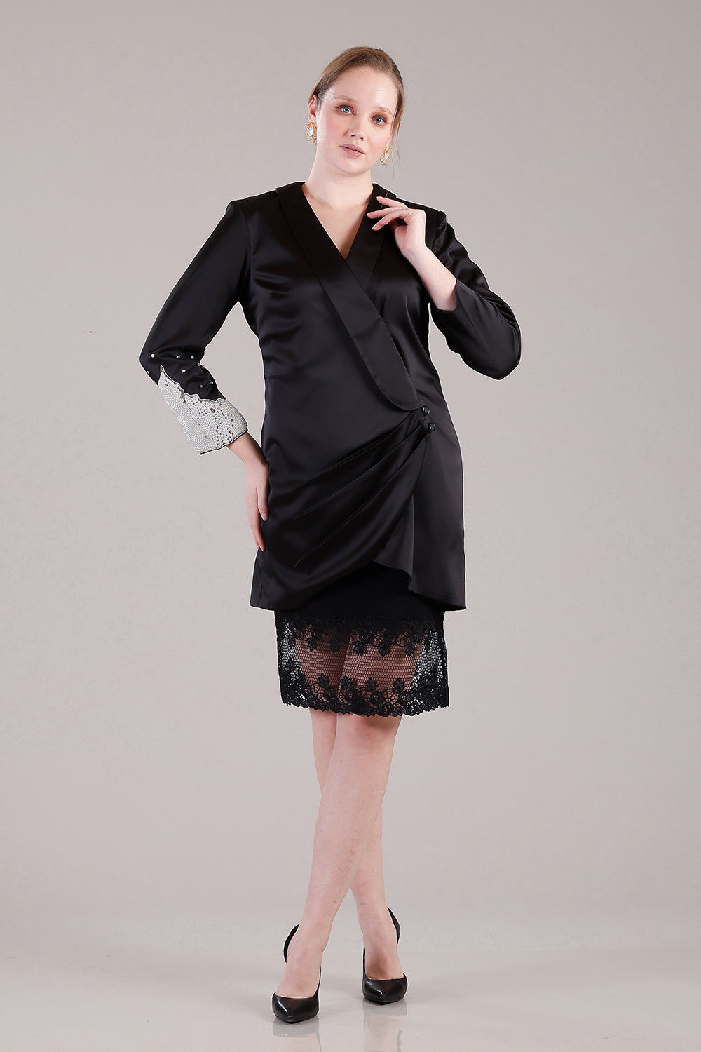 Black coat pleated dress with pearls and crystals detailing on one sleeve