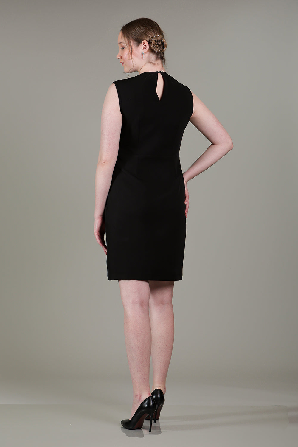 Black cowl dress with sheer net and rose gold rhinestone detailing on bodice