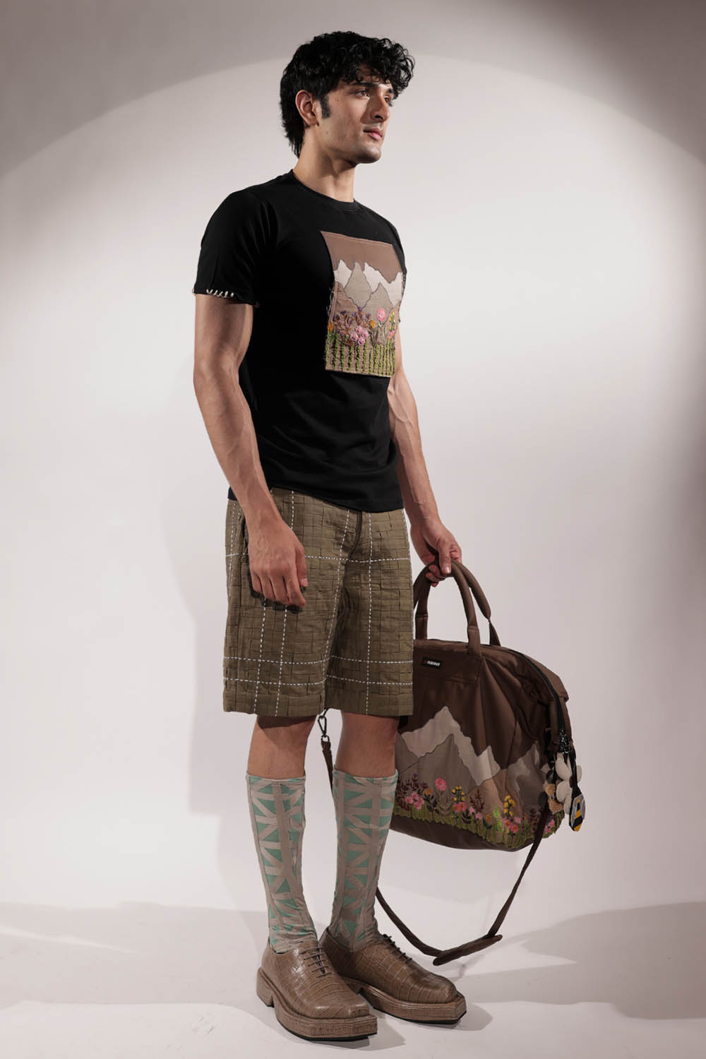 Black T-shirt with Valley-inspired patchwork