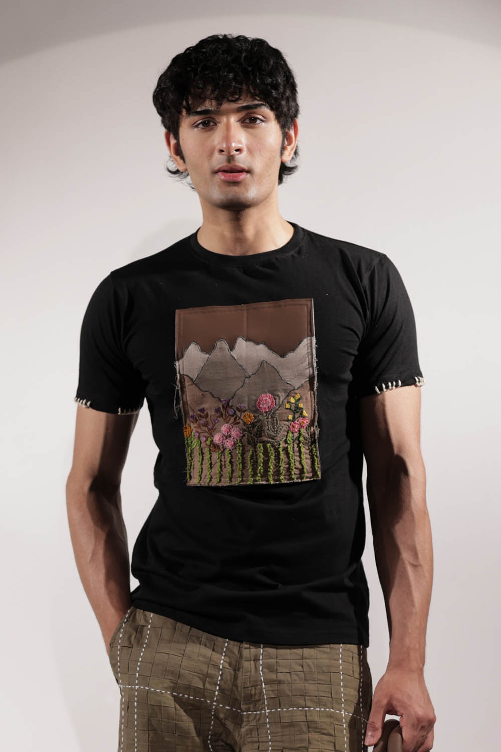 Black T-shirt with Valley-inspired patchwork