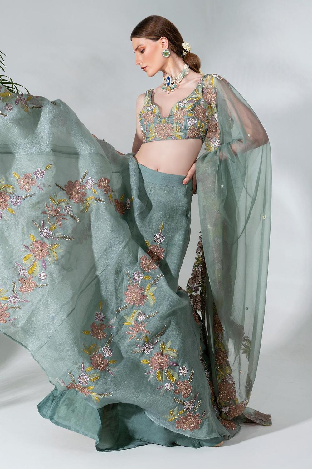 Dusty green lehenga featuring floral applique patterns