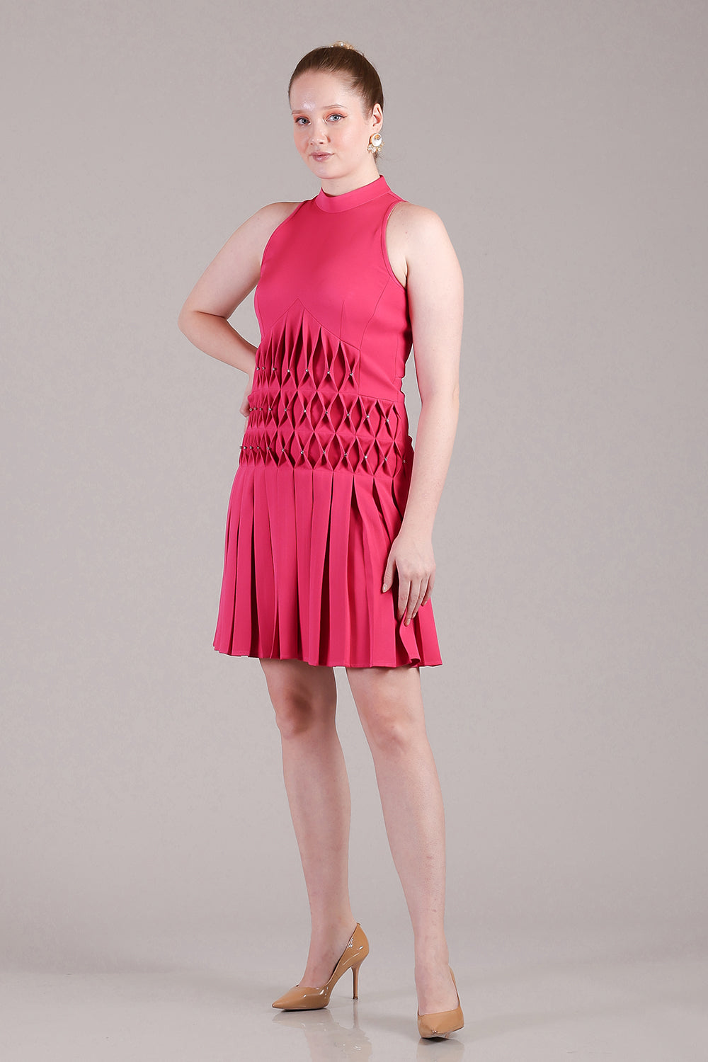 Hot pink pleated dress with cross stitch detailing and crystals highlighted