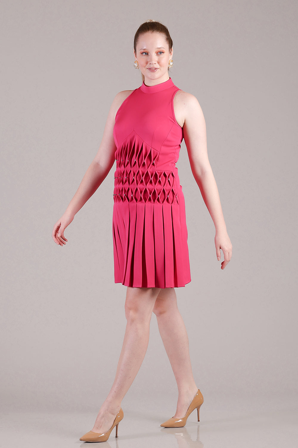 Hot pink pleated dress with cross stitch detailing and crystals highlighted