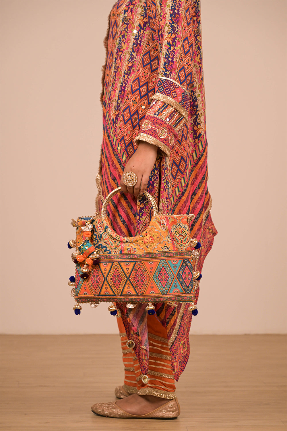Asymmetrical Orange Kurta Set In Creope with Canvas Tote Bag
