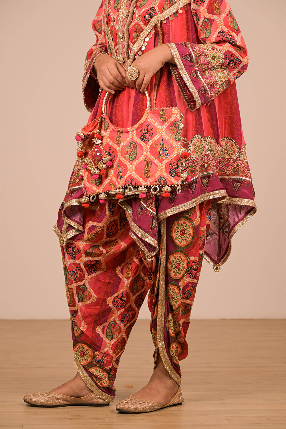 Vibrant Persian Red Crepe Suit Set with Tulip Pants and Heavy Embroidered Potli Bag