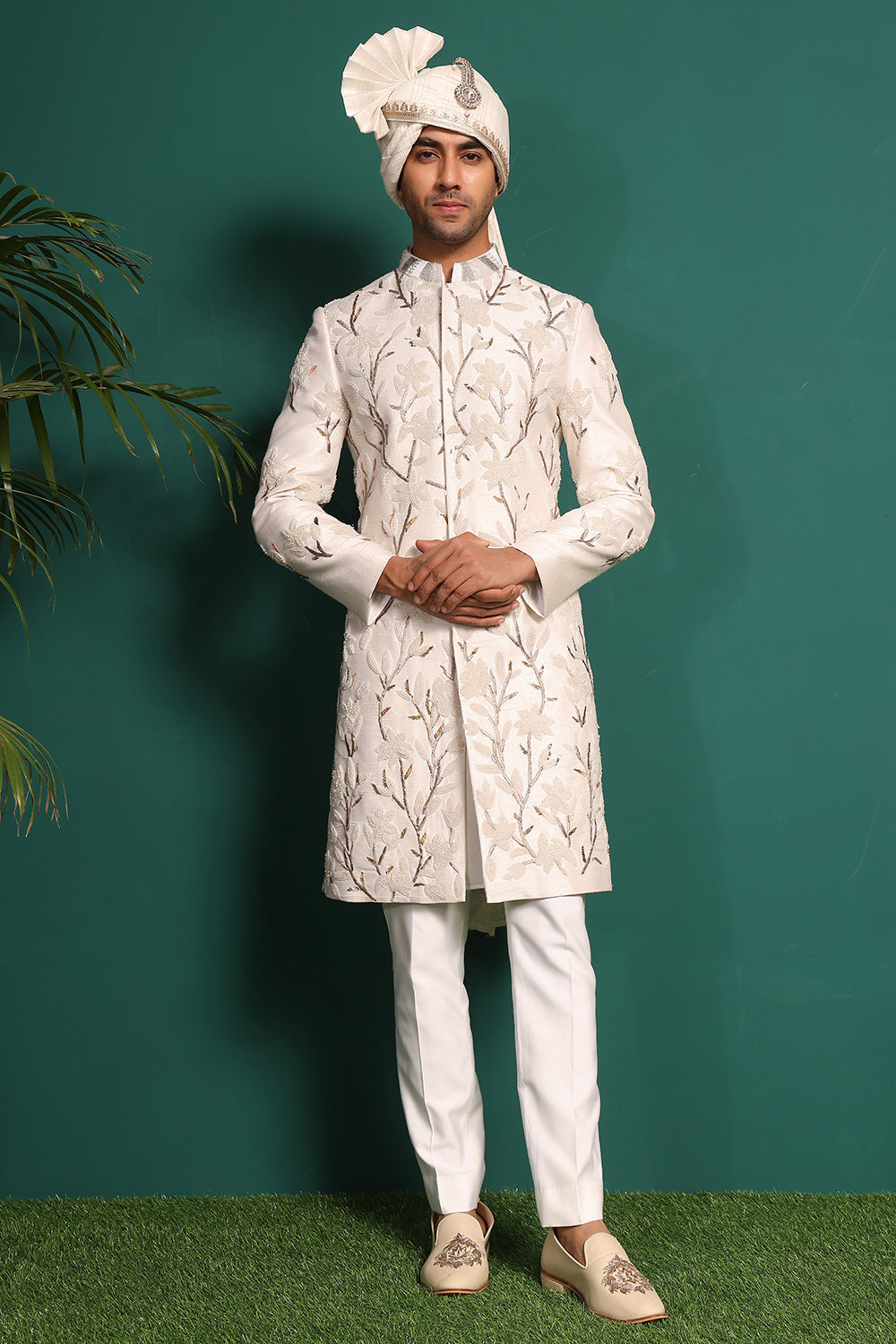 Ivory white raw silk sherwani with heavy embellished work