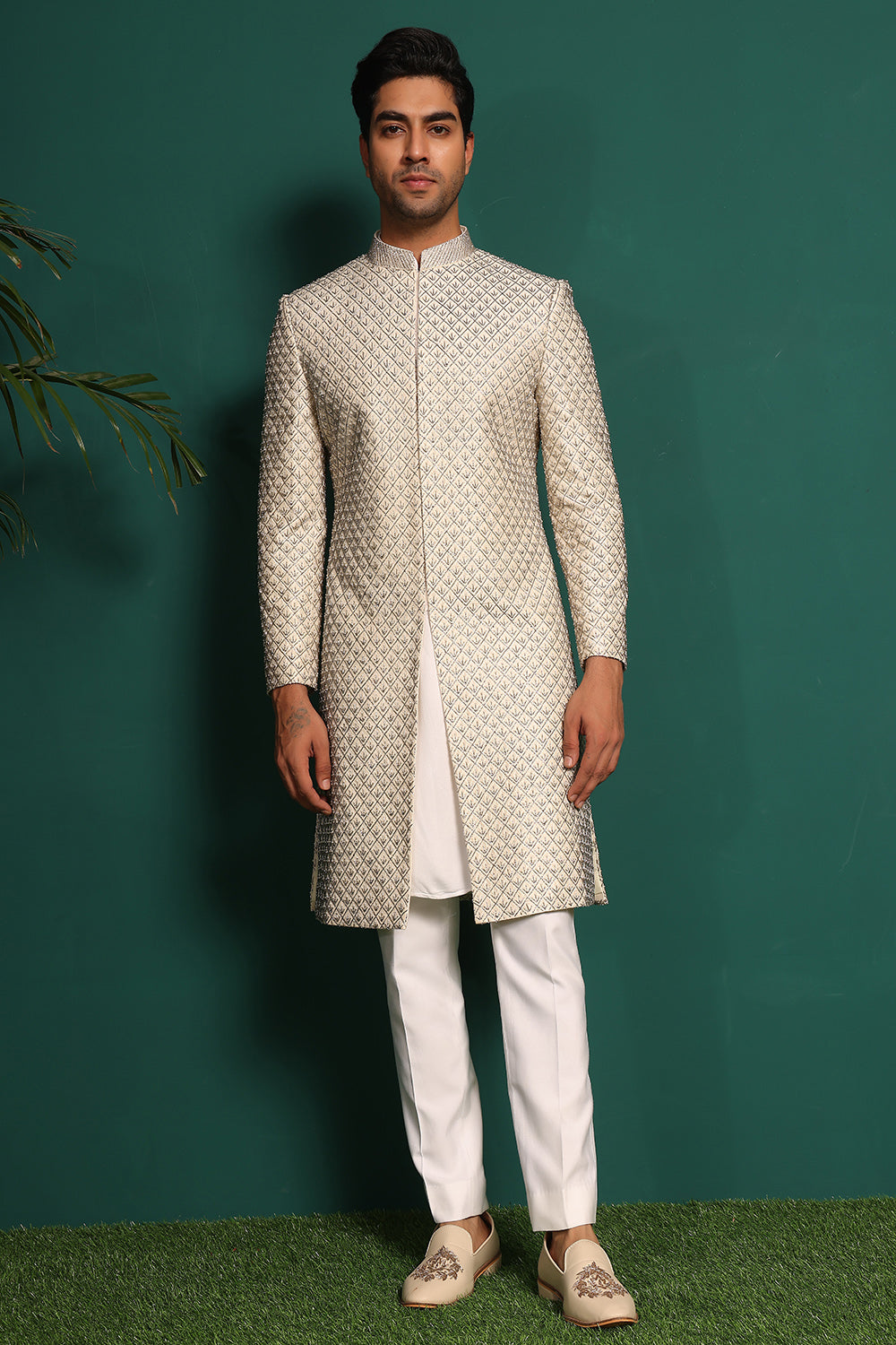 Ivory White Sherwani heavily embellished with moti and cutdaana