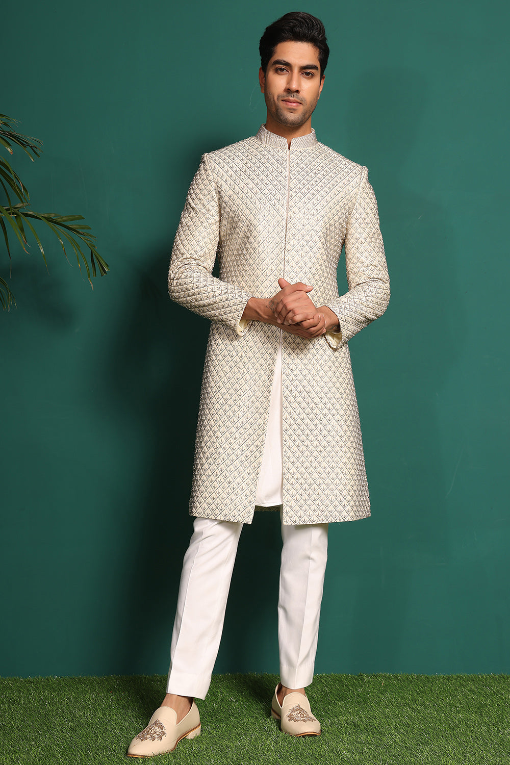 Ivory White Sherwani heavily embellished with moti and cutdaana