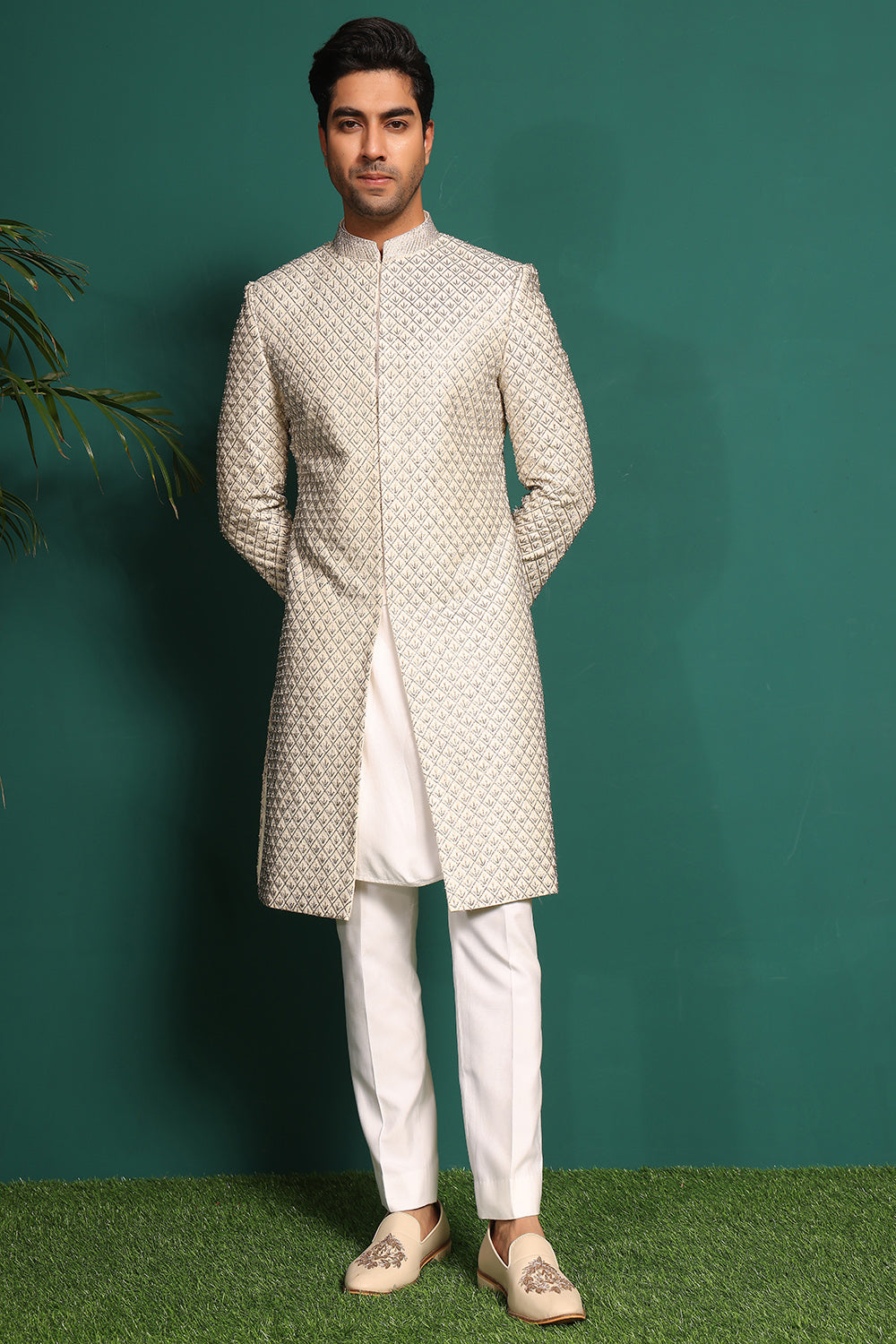 Ivory White Sherwani heavily embellished with moti and cutdaana