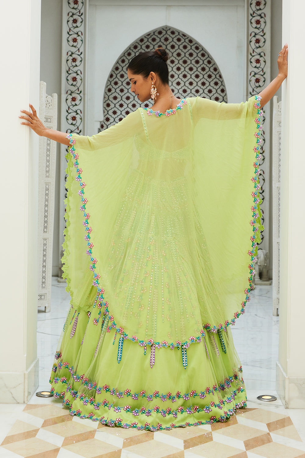 Lime Green Net Lehenga Choli With A Georgette Cape