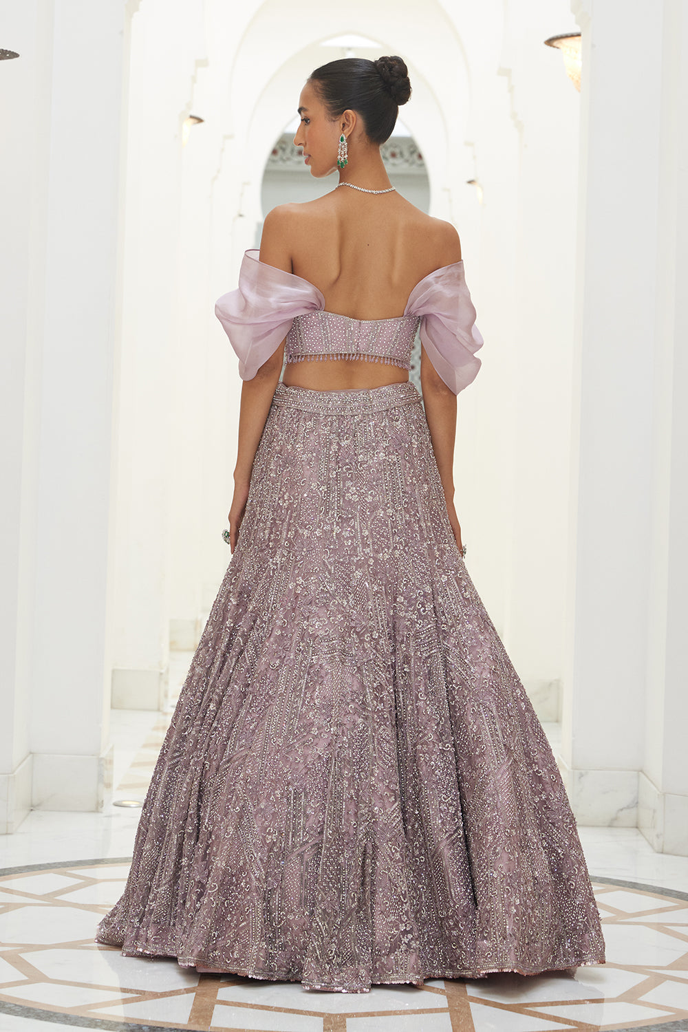 Mauve Net Fistailed Skirt With A Corsetted Blouse