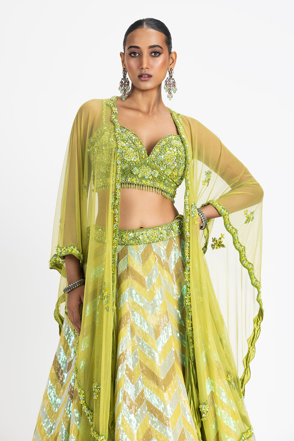 Mehndi Green Sequinned Lehenga With A Bustier And Net Cape