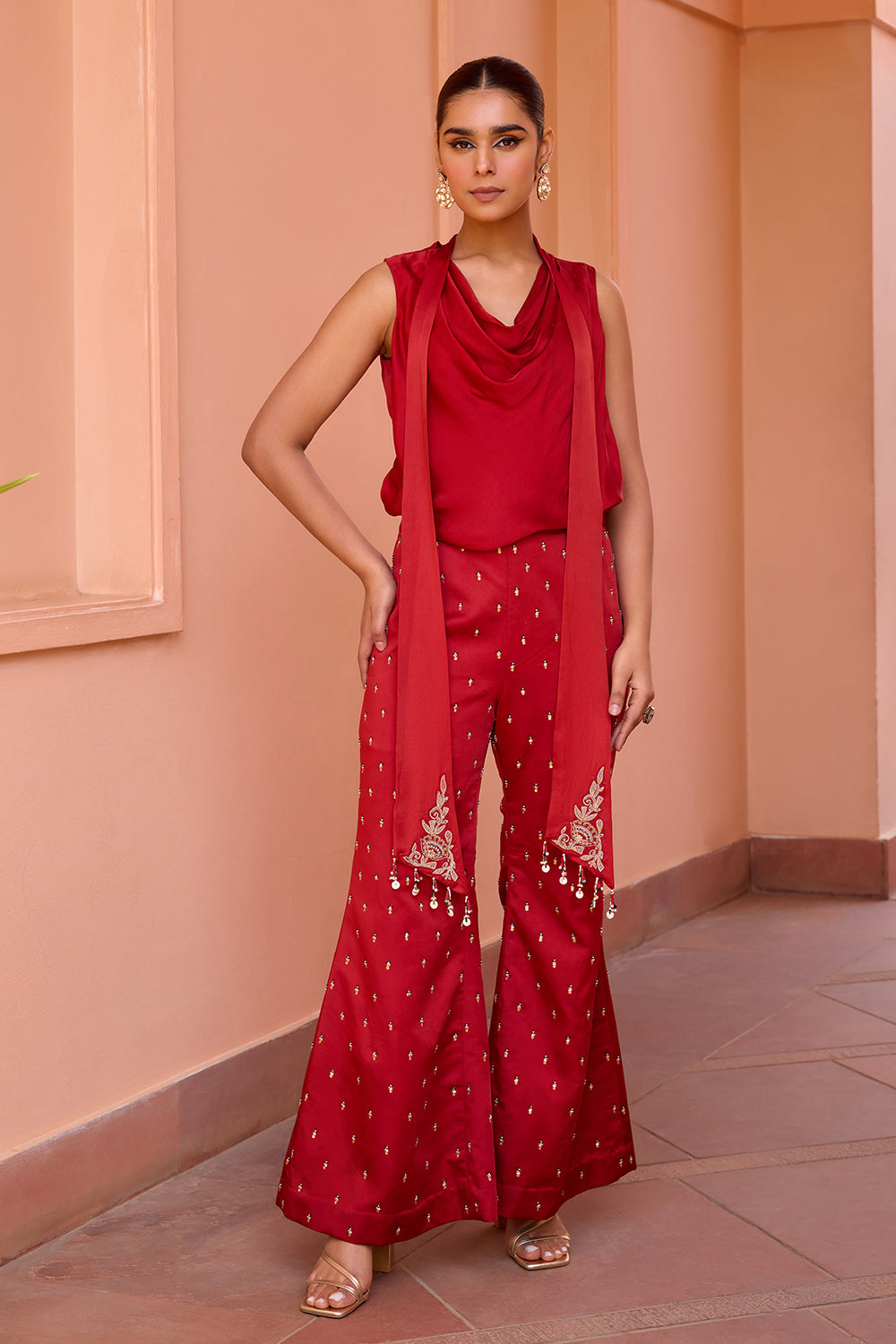 Red cowl drape top with embroidered pants