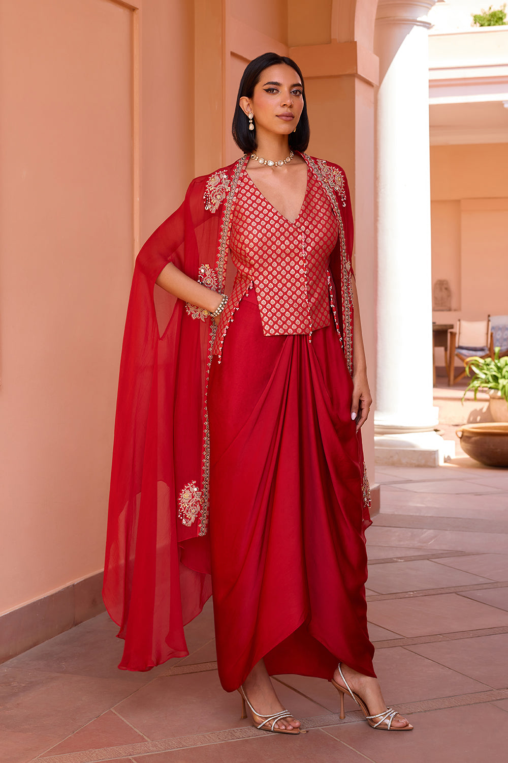 Red embroidered cape with waistcoat and skirt