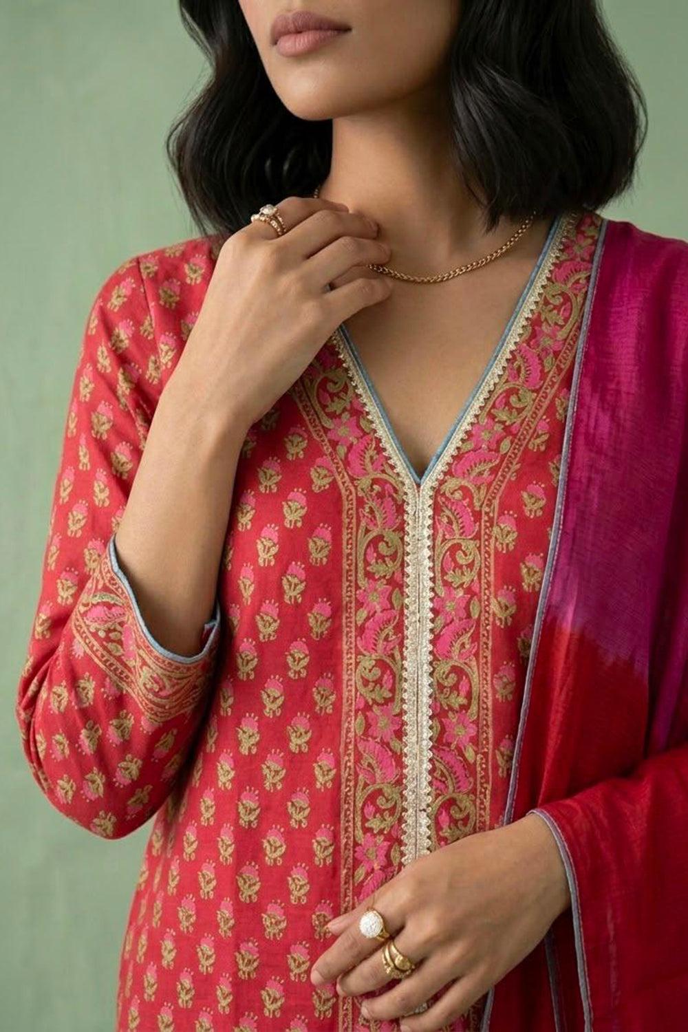 Red kurta set paired with shaded dupatta