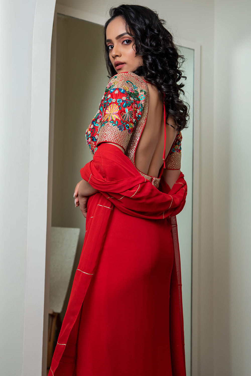 Red kali saree with embroidered blouse